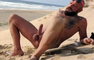 romps himself on the beach with a wooden